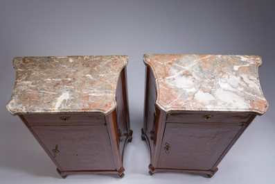 A pair of French Louis XVI style single door hall cabinets with floral marquetry, gilt bronze mounts and marble tops, 19th C.