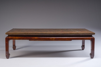 A Chinese low table with partly polychromed wooden top with engraved dragon and phoenix design, Qing and 20th C.