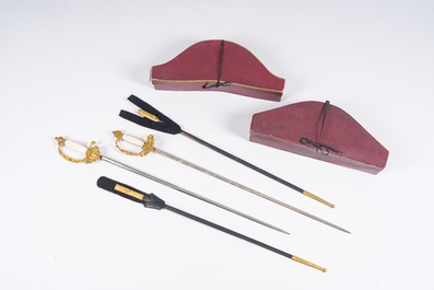 Two Belgian ceremonial costumes with bicorn hats and sables, 19th/20th C.