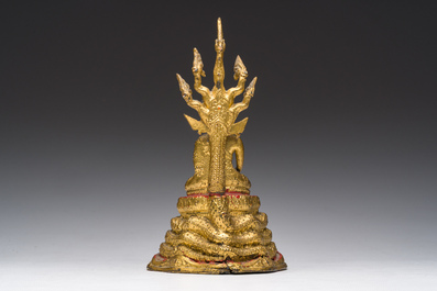 A Thai gilt bronze figure of Buddha seated on the Naga throne, Rattanakosin, 19th C.