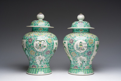 A pair of Chinese verte biscuit vases and covers with landscapes and floral design, 19th C.