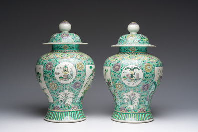 A pair of Chinese verte biscuit vases and covers with landscapes and floral design, 19th C.