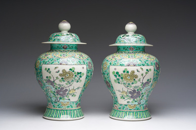 A pair of Chinese verte biscuit vases and covers with landscapes and floral design, 19th C.
