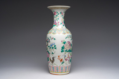 A Chinese famille rose vase with roosters among blossoming branches, 19th C.
