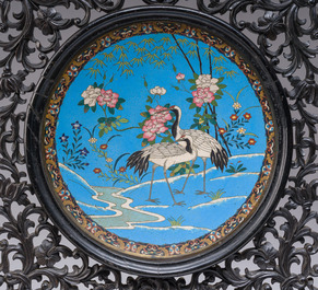 A reticulated Chinese wooden table screen with a Japanese cloisonn&eacute; dish, 19th C.