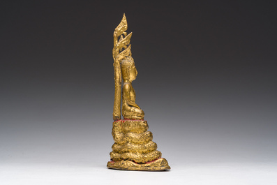 A Thai gilt bronze figure of Buddha seated on the Naga throne, Rattanakosin, 19th C.