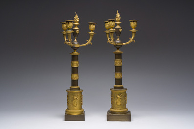 A pair of French Empire gilt and patinated bronze three-light candelabre, 19th C.