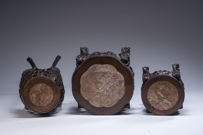 Three Chinese reticulated wooden stands with marble tops, 20th C.