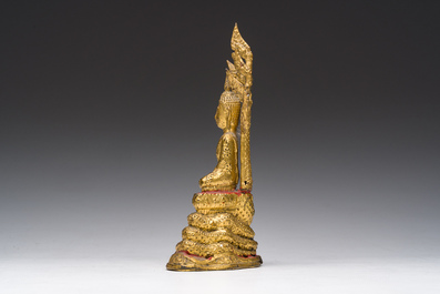 A Thai gilt bronze figure of Buddha seated on the Naga throne, Rattanakosin, 19th C.