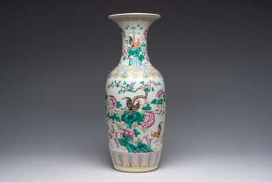 A Chinese famille rose vase with roosters among blossoming branches, 19th C.