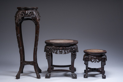 Three Chinese reticulated wooden stands with marble tops, 20th C.