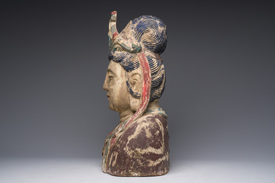 A large Chinese polychromed wooden bust of Buddha, 20th C.