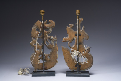 A pair of gilt and patinated wooden fragments mounted into lamps, 18th C. and later