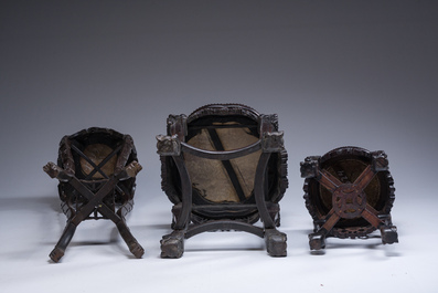 Three Chinese reticulated wooden stands with marble tops, 20th C.