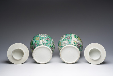 A pair of Chinese verte biscuit vases and covers with landscapes and floral design, 19th C.