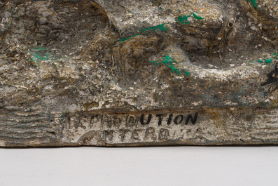 Belgian school, Van den Balck (19th/20th C.): A roaring lion on a rock struck by arrows, green and gray patinated plaster, Brussels