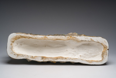 Belgian school, Van den Balck (19th/20th C.): A roaring lion on a rock struck by arrows, green and gray patinated plaster, Brussels