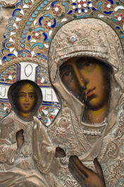 A Russian orthodox 'Virgin Mary Tricherousa (the three-handed)' icon with partly enamelled brass oklad or riza, 19th C.