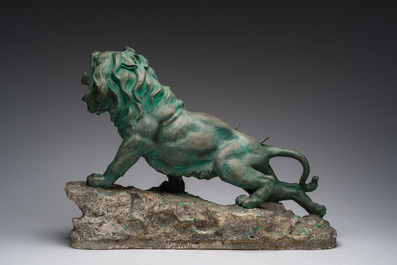Belgian school, Van den Balck (19th/20th C.): A roaring lion on a rock struck by arrows, green and gray patinated plaster, Brussels