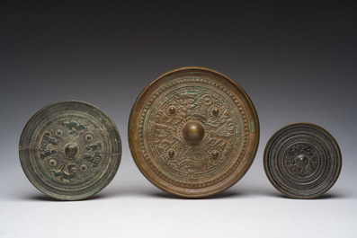 Three Chinese bronze mirrors with relief design, Qing