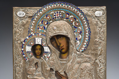 A Russian orthodox 'Virgin Mary Tricherousa (the three-handed)' icon with partly enamelled brass oklad or riza, 19th C.