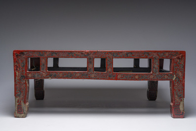 A Chinese rectangular lacquered wooden low table with figures in a garden, 19th/20th C.