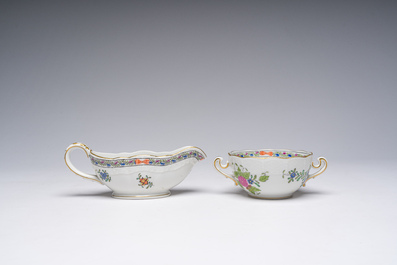 A large Hungarian Herend gilt and polychrome decorated porcelain set with floral design, 20th C.