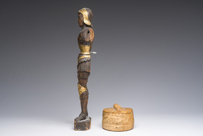 A Flemish parcel-gilt wooden 'soldier', a double-sided bronze cross, a Russian orthodox travel icon and a carved stone box and cover, 16th C. onwards