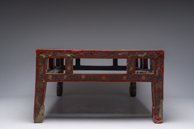 A Chinese rectangular lacquered wooden low table with figures in a garden, 19th/20th C.