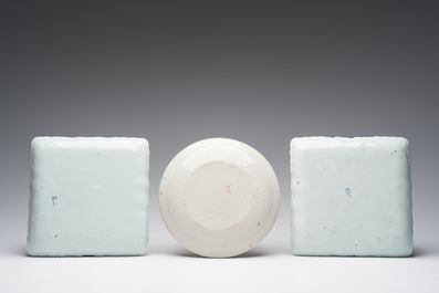 Two square blue and white Dutch Delft 'herring fishery' dishes and a polychrome 'quails' plate, 18th/19th C.