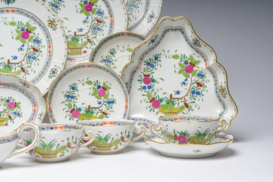 A large Hungarian Herend gilt and polychrome decorated porcelain set with floral design, 20th C.