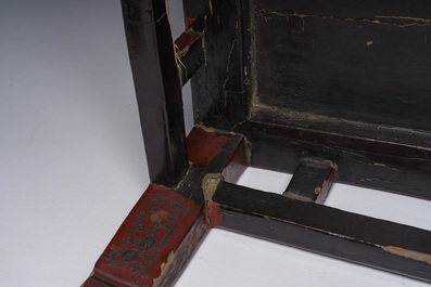 A Chinese rectangular lacquered wooden low table with figures in a garden, 19th/20th C.