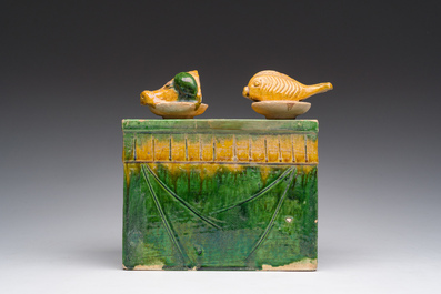 A Chinese sancai glazed miniature offering table with a fish and a pig's head, probably Ming