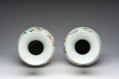 A pair of Chinese famille rose vases and a tall blue and white vase, 19th/20th C.