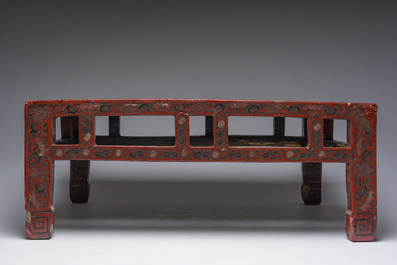 A Chinese rectangular lacquered wooden low table with figures in a garden, 19th/20th C.