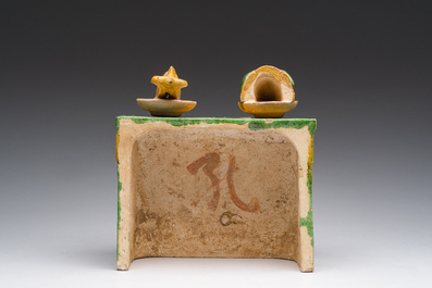 A Chinese sancai glazed miniature offering table with a fish and a pig's head, probably Ming