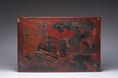A Chinese rectangular lacquered wooden low table with figures in a garden, 19th/20th C.