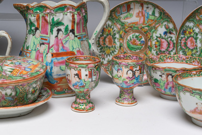 A Chinese 20-piece Canton famille rose tea service with floral design and palace scenes, 19th C.