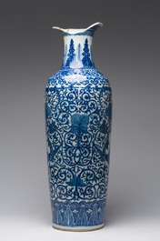 A pair of Chinese famille rose vases and a tall blue and white vase, 19th/20th C.