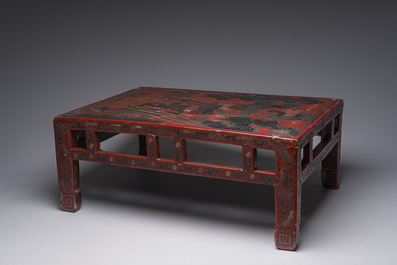 A Chinese rectangular lacquered wooden low table with figures in a garden, 19th/20th C.