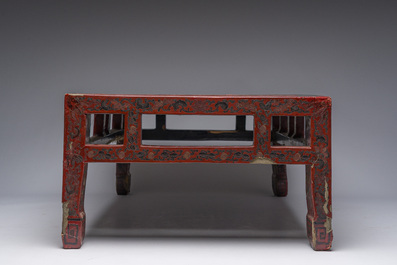 A Chinese rectangular lacquered wooden low table with figures in a garden, 19th/20th C.