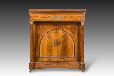 A French Empire style gilt bronze mounted two-door mahogany cabinet with a green marble top, 19th C.