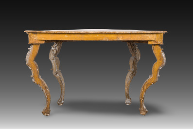 An Italian patinated wooden console with a faux marble top and lion paws, 18th C.