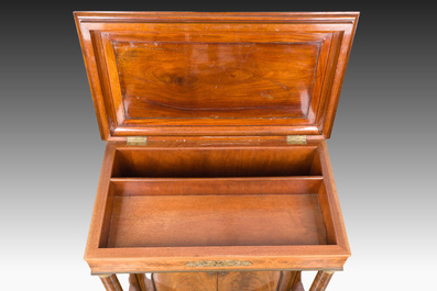 A French Empire style gilt bronze mounted two-door mahogany cabinet with a green marble top, 19th C.