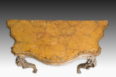 An Italian patinated wooden console with a faux marble top and lion paws, 18th C.