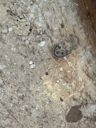 An Italian patinated wooden console with a faux marble top and lion paws, 18th C.