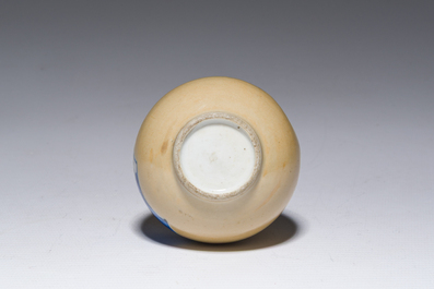 A Chinese blue and white caf&eacute;-au-lait-ground double gourd vase, Kangxi