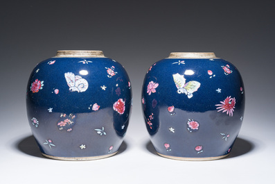 A pair of Chinese blue ground jars with enamelled decoration of butterflies and flowers, 19th C.