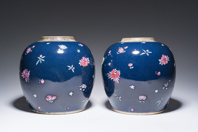 A pair of Chinese blue ground jars with enamelled decoration of butterflies and flowers, 19th C.