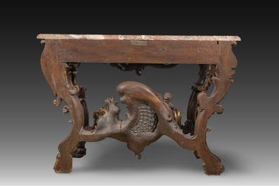 An impressive parcel-gilt and patinated wooden console in Rococo style, probably Italy, 19th C.
